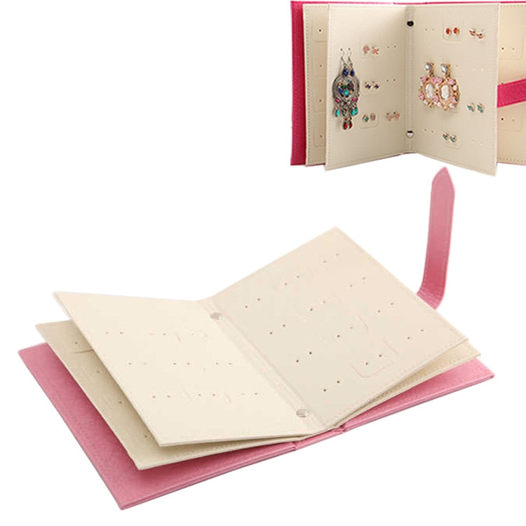 Pink and cream book-shaped earring display rack with hanging strap loop