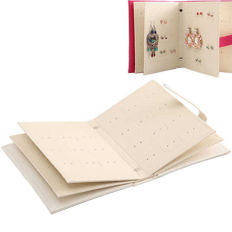 Cream book-shaped jewelry display rack with multiple stacked inner pages