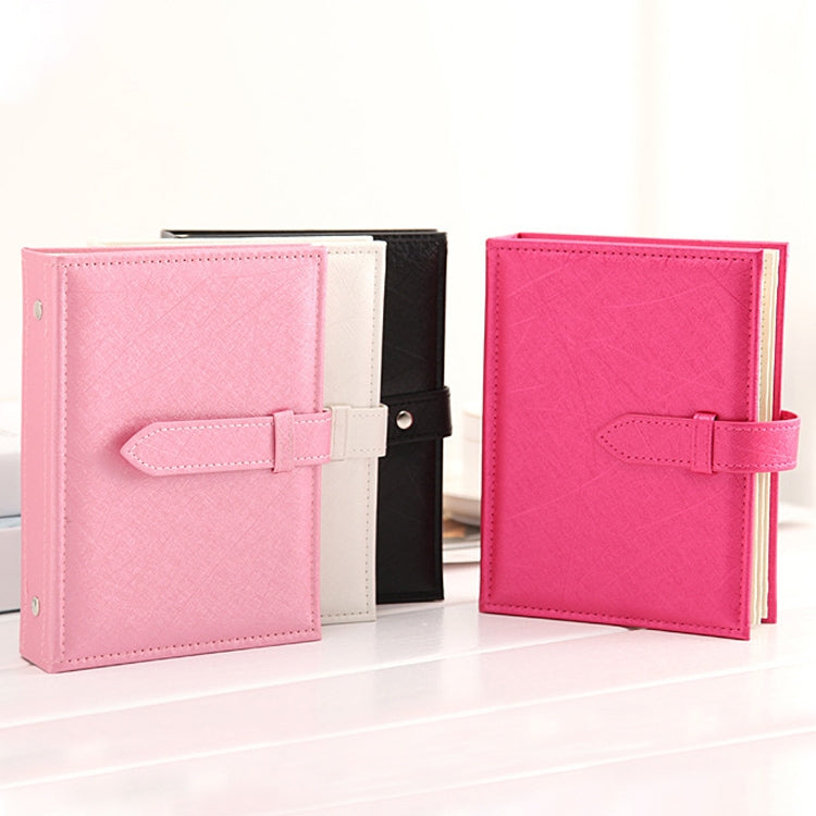 Pink book-shaped earring display storage box with fold strap and open cover