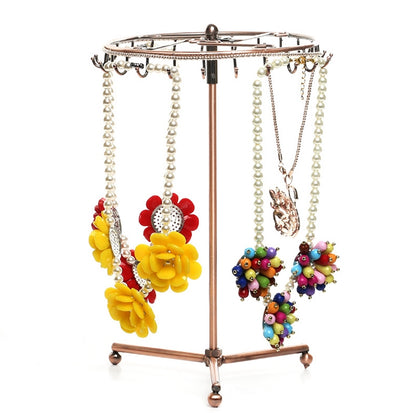 Rose gold rotating jewelry display stand with hanging necklace and bracelet hooks