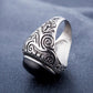 Men’s titanium steel ring with dark oval gemstone and decorative side engravings