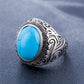 Men’s oval turquoise-stone ring with ornate silver filigree bezel