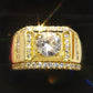 Gold-tone men’s ring with square center zircon, glittering side bands