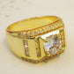 Gold-tone men’s ring side view with square center zircon and row of rhinestones