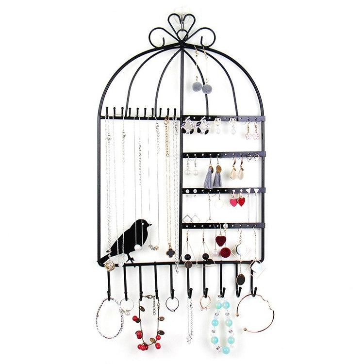 Black birdcage jewelry display rack with hanging earrings, bracelets, and necklace chains