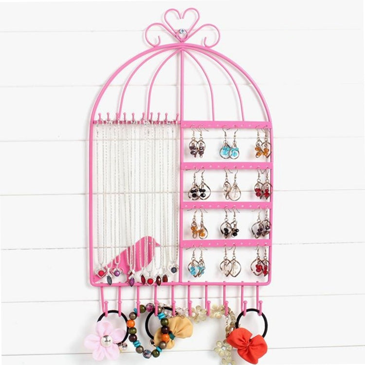 Pink birdcage jewelry display rack with hanging hooks and earring rows