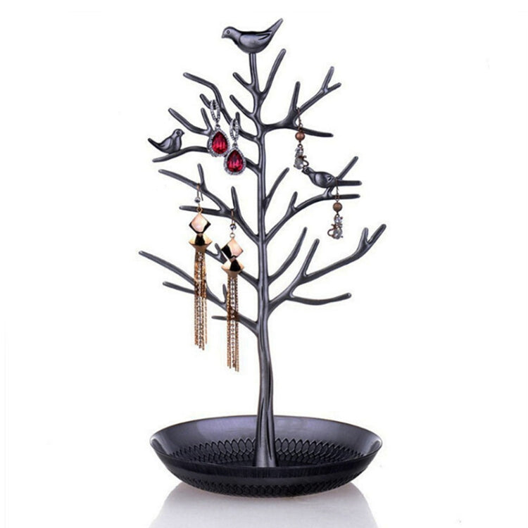 Black tree-shaped jewelry display rack with bird charms and round earring tray