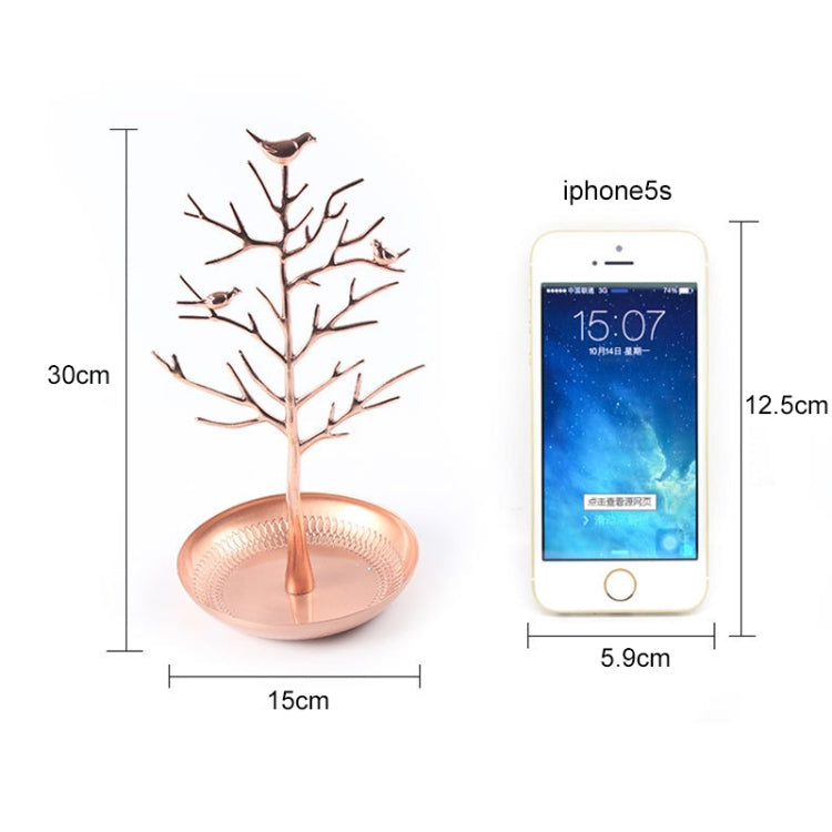 Rose gold tree-shaped jewelry organizer with bird charms and round earring tray