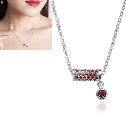 Silver chain necklace with rectangular red crystal bar pendant and round red drop charm
