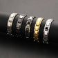 Men's titanium steel link chain bracelet, gold and silver tones with black accents