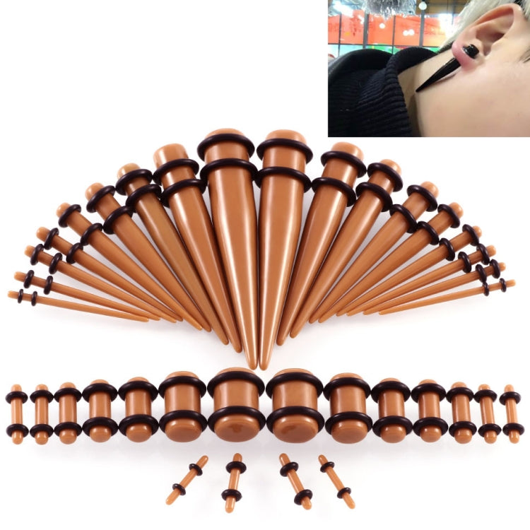 Brown acrylic ear stretcher set with dark rings, flared plugs, and insertion pins