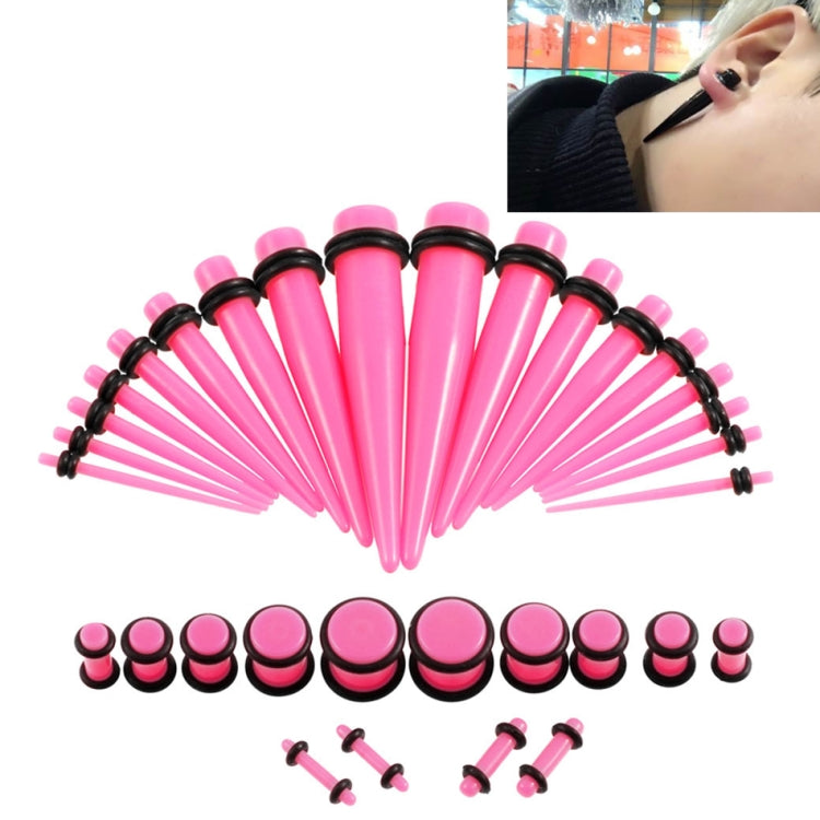 Pink acrylic ear stretcher set with black rings, flared plugs, and insertion pins
