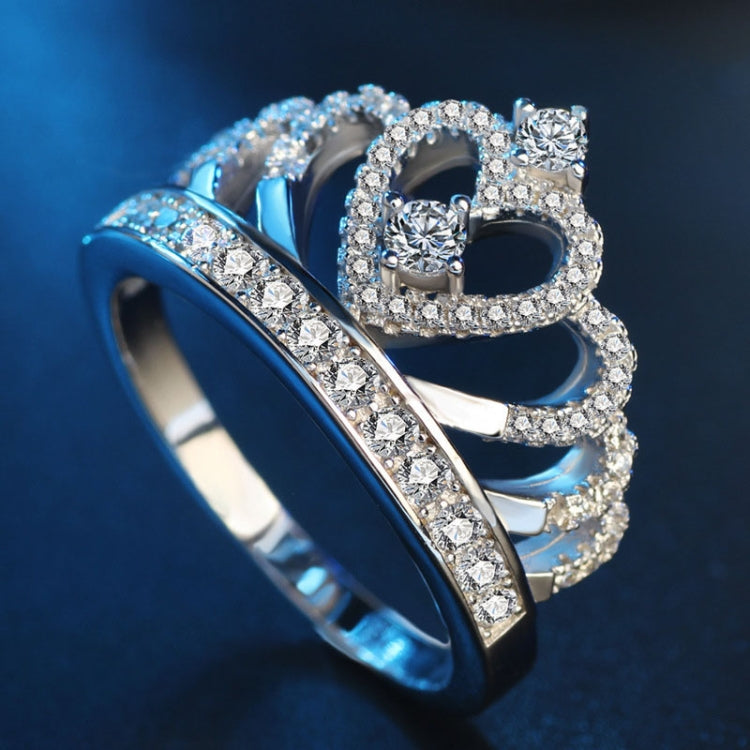 Crown zircon ring with heart-like center stones and sparkling halo, silver-toned band