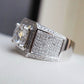 Silver micro-pave rhinestone ring with cushion-cut clear center stone and side sparkle