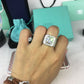 Silver rhinestone square ring on hand, showing large clear center stone and paved sides