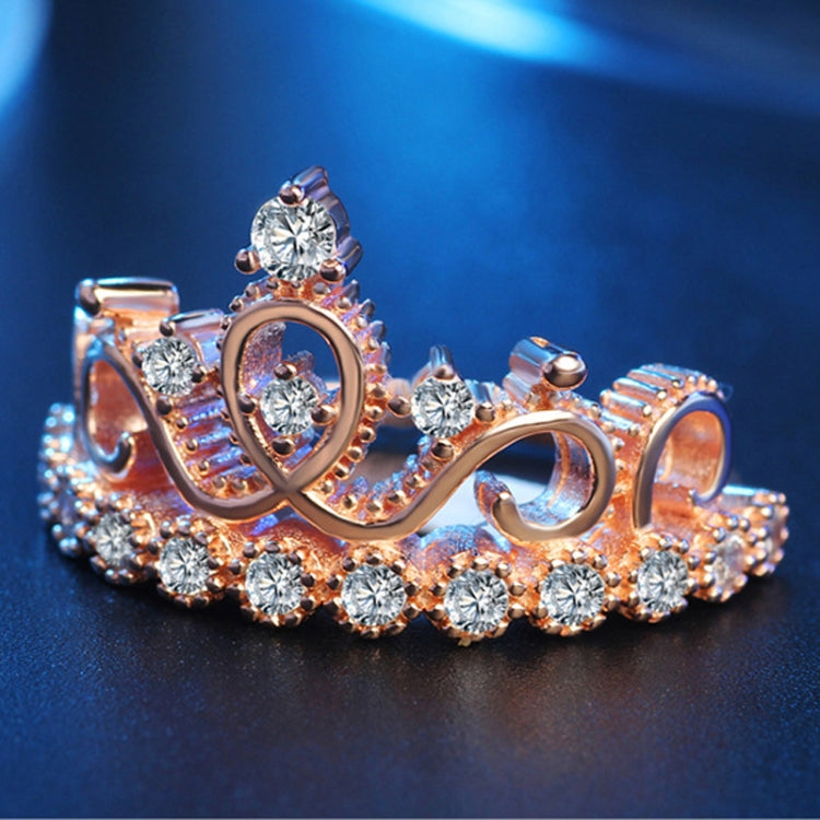 Crown-shaped rose gold ring with round zircon stones and oval cutout
