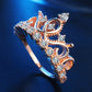 Rose gold crown zircon ring with oval and round clear stones, front view
