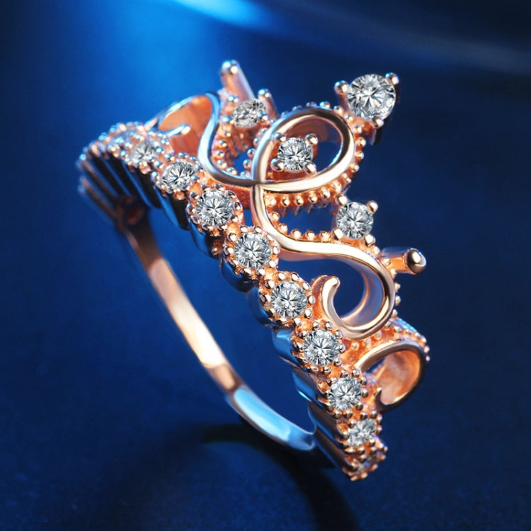 Rose gold crown zircon ring with oval and round clear stones, front view