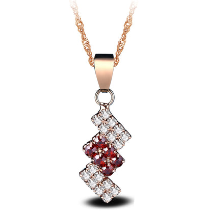 Gold-plated crystal pendant necklace with red and clear geometric drop