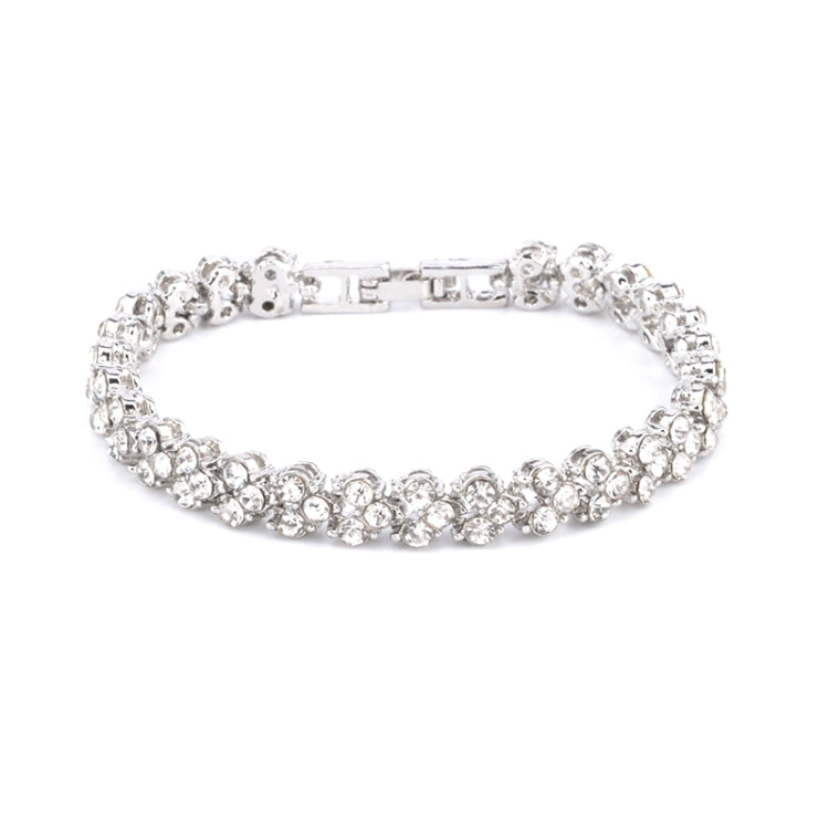 Silver crystal tennis bracelet with hinged clasp and continuous row of round stones