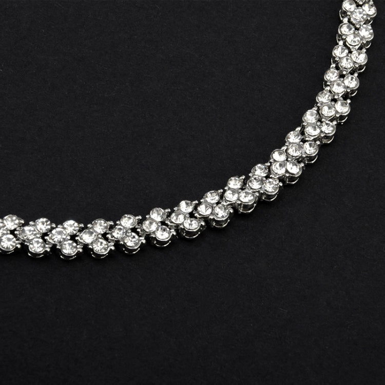 Silver crystal tennis bracelet close-up, continuous row of round rhinestones