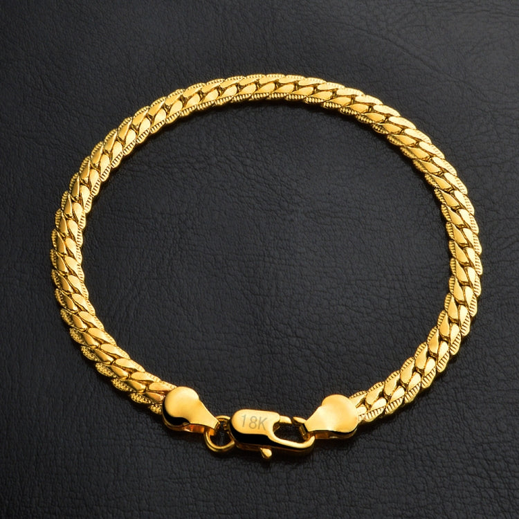 18k yellow gold bracelet with braided chain and heart-shaped clasp, center tag detail