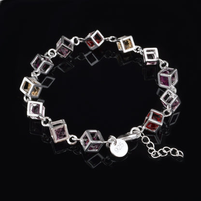 Silver rhinestone checker bracelet with hollow square links in red, purple, yellow, clear.