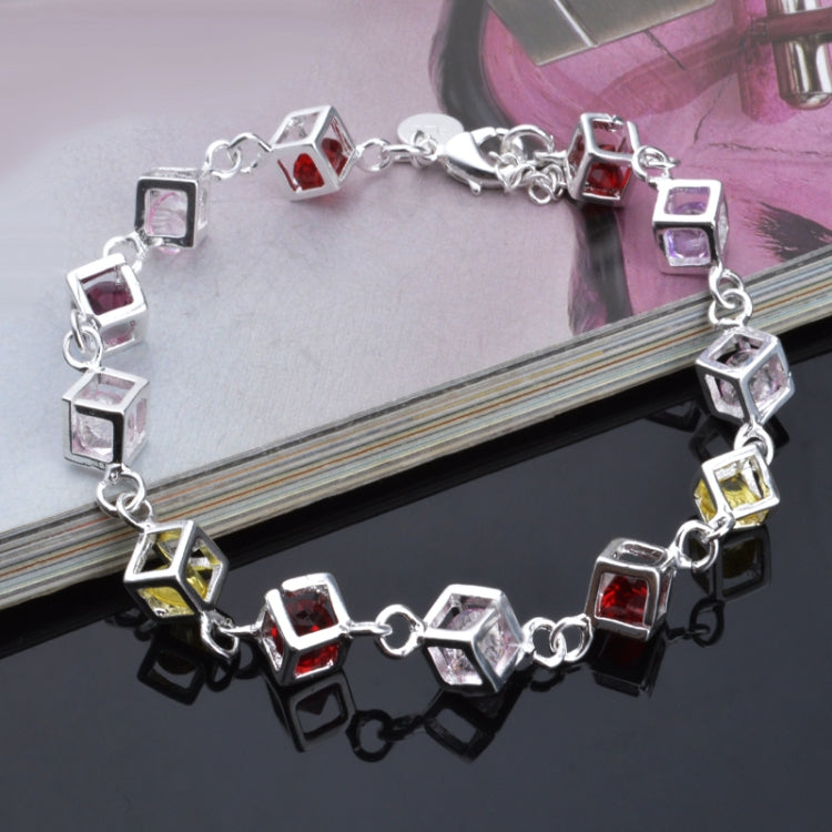 Silver rhinestone bracelet with hollow square and multicolor checker stones, close-up angle.