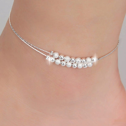Silver-tone anklet with frosted bead row and small dangling star charm