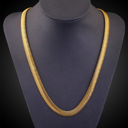 Gold flat snake-link chain necklace on mannequin bust
