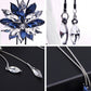 Blue and clear rhinestone flower necklace with marquise drop earrings, silver tone