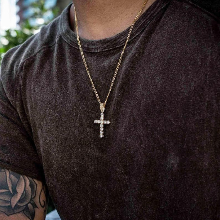 Gold-tone cross pendant necklace worn with link chain