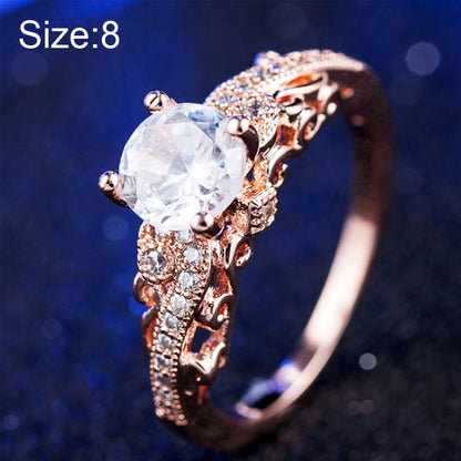Rose gold zircon engagement ring with round clear center stone, size 8