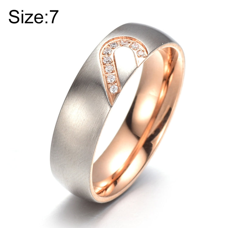Brushed titanium steel ring with heart-shaped diamond accents, rose-gold interior, size 7