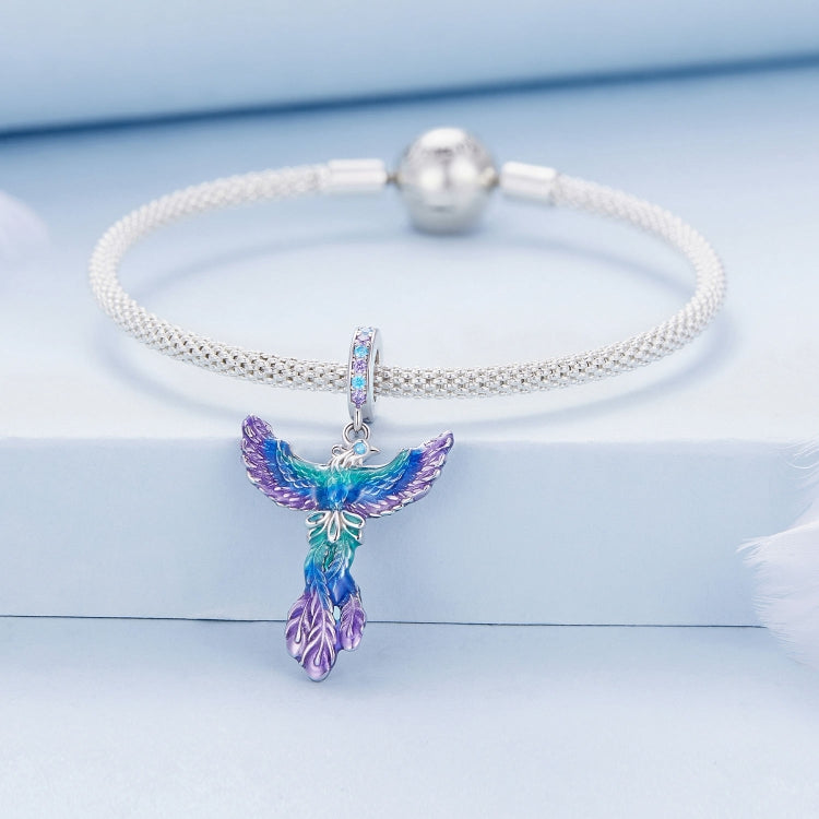 Silver mesh bracelet with dangling colorful phoenix charm in blue, purple, green enamel