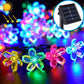 Multicolor solar flower LED bulbs with translucent flower shapes and solar panel inset