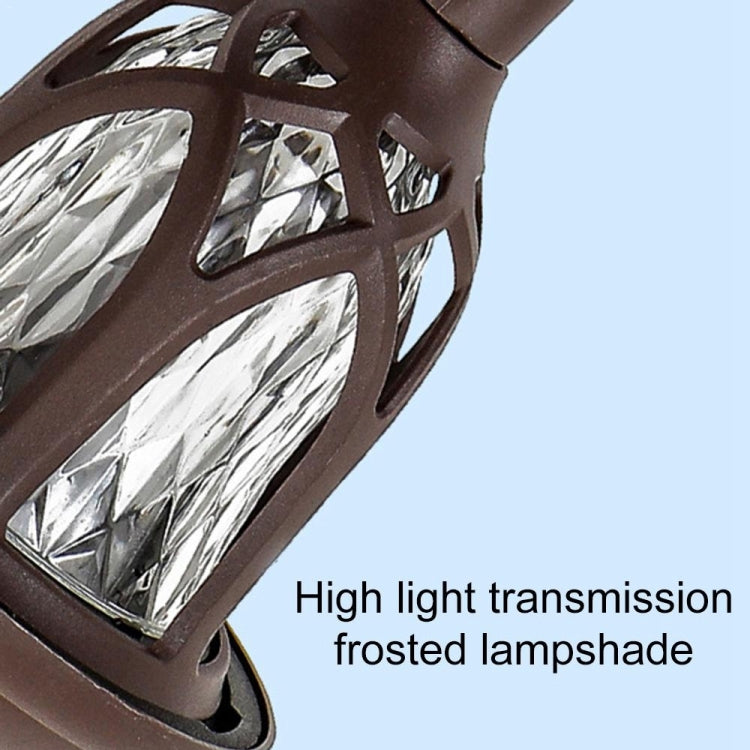 Lantern head of solar stake light with frosted shade and decorative cutouts