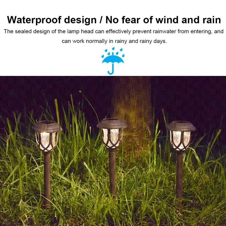 Outdoor solar stake lantern lights with lantern heads in nighttime glow