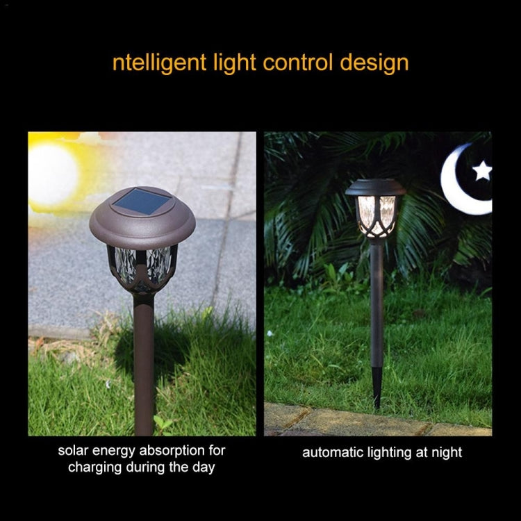 Solar stake garden lanterns on grass with lit lantern heads at night