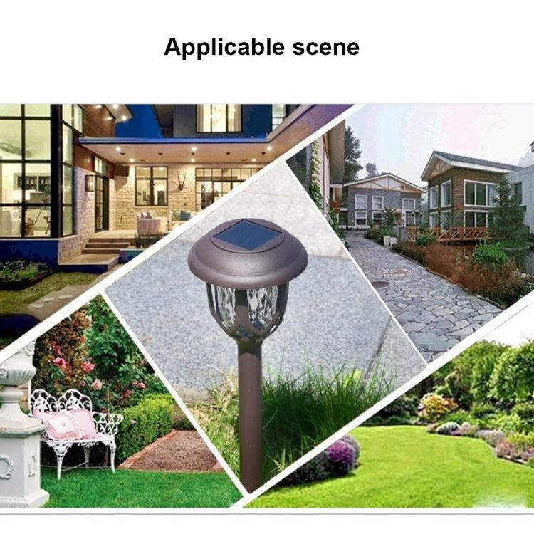 Solar stake lantern light on a garden path with decorative lantern head
