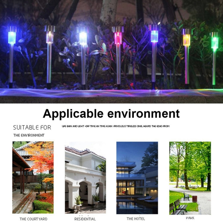 Solar LED garden stake lights glowing blue, pink, and green along walkway