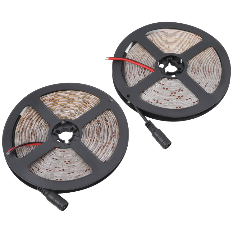 Two LED rope light reels with connector cables and bare PCB strips on black spools