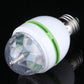 Close-up E27 LED bulb with faceted clear dome, white body, green ring and metal thread