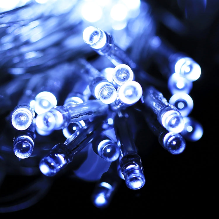 Cool white LED string light bulbs glowing with clear plastic housings