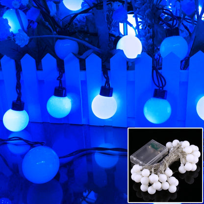 Blue LED string lights with round globe bulbs on a hanging wire strand