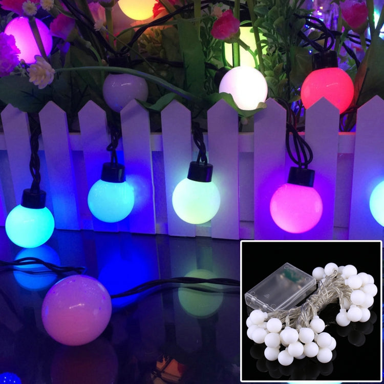 Colorful LED globe string lights with round bulbs in blue, purple, and pink