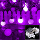 Purple LED globe string lights with round lit bulbs on a hanging strand