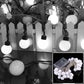 Round LED globe string lights with black cable, warm white bulbs
