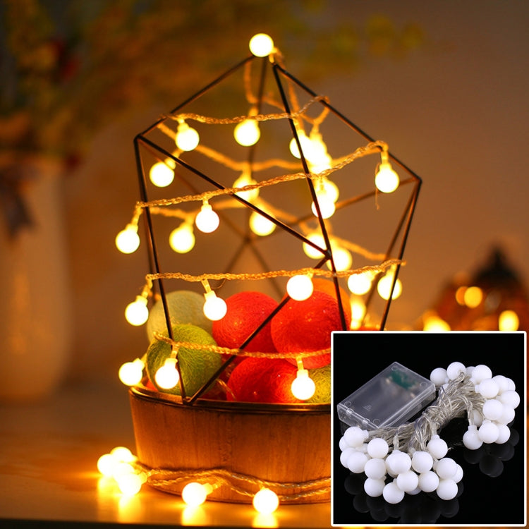Warm white LED globe string lights with black cable and glowing round bulbs
