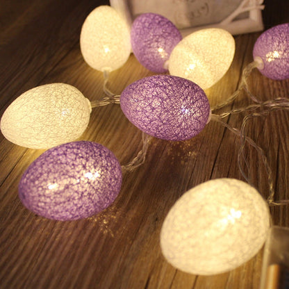 Purple and white cotton egg string lights on thin wire, battery-powered glow bulbs